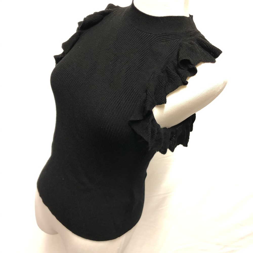 Black mock neck sleeveless knit with ruffles